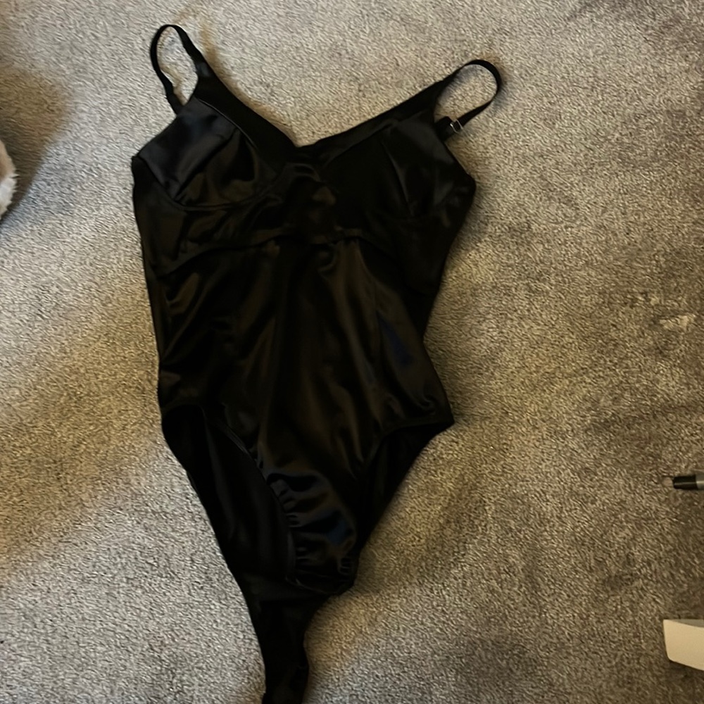 A black silk bodysuit